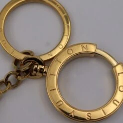 ELADY LOUIS VUITTON Portocre Swing Keychain M65997 Metal Gold Keyring Bag Charm -Best Jewelry Store 2000 ad27f7b1 ab92 49bd 8831 b3e8bfbf20ca
